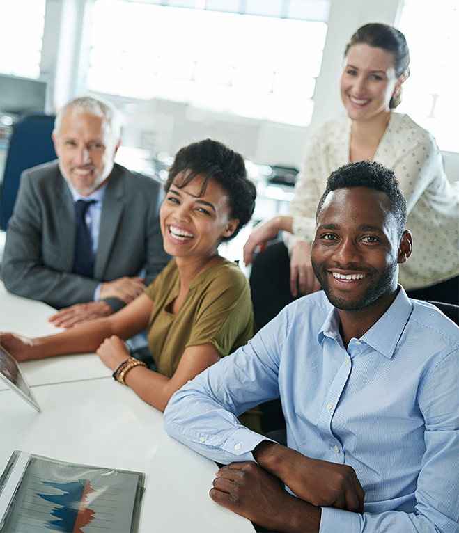 Diverse business professionals discussing benefits of an MBE course for certification